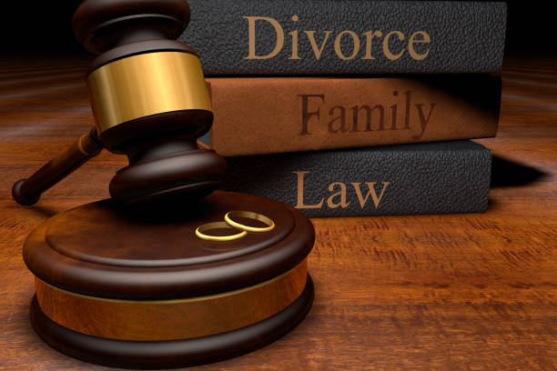 Gavel, Divorce Law Books And Wedding Rings On Wooden Desk